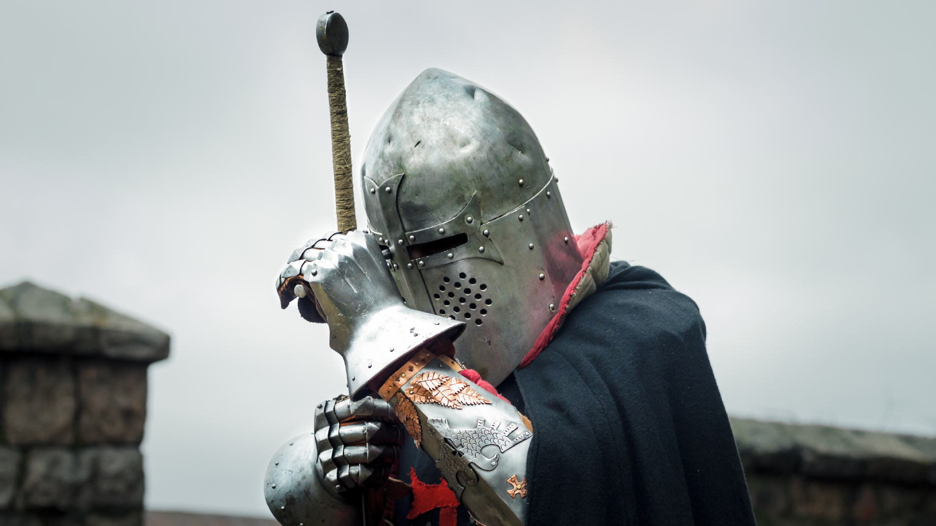 knight wearing steel gauntlets